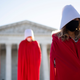 Illustration for article titled Protestors in iHandmaids Tale/i robes descend on Amy Coney Barrett Senate confirmation hearing